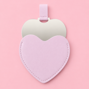 Espejo en forma de corazón con su fundita en color rosa